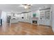 Spacious living area featuring hardwood floors, fireplace, and built-in shelving for a cozy and stylish space at 148 Cowrie Ct, Mount Pleasant, SC 29464