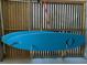 Two paddleboards are securely stored on a wooden rack, ready for water adventures at 148 Cowrie Ct, Mount Pleasant, SC 29464