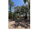 Secluded park bench nestled among trees, providing a peaceful spot to relax in a natural setting at 148 Cowrie Ct, Mount Pleasant, SC 29464