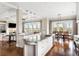 This kitchen has white cabinets, granite countertops, stainless steel appliances, and a view of the water at 1500 Bower Ln, Johns Island, SC 29455