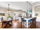 Well-equipped kitchen with island seating, stainless steel appliances, and adjacent dining area at 1500 Bower Ln, Johns Island, SC 29455