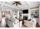 Elegant living room features a fireplace, coffered ceilings, and custom built-in shelving at 1500 Bower Ln, Johns Island, SC 29455