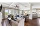 Spacious living room with large windows offering scenic views and an open floor plan at 1500 Bower Ln, Johns Island, SC 29455