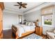 Spacious bedroom with a coffered ceiling, hardwood floors, and a window with natural light at 1500 Bower Ln, Johns Island, SC 29455