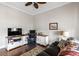 Home office featuring custom built-ins, hardwood floors, and a comfortable seating area at 1500 Bower Ln, Johns Island, SC 29455