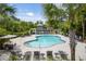 A stunning swimming pool area with plenty of lounge chairs at 1500 Bower Ln, Johns Island, SC 29455