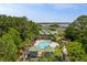 Aerial view of a pool and covered pavilion surrounded by lush landscaping at 1500 Bower Ln, Johns Island, SC 29455