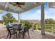 Inviting covered porch with outdoor seating, a ceiling fan, and scenic views of the marsh at 1500 Bower Ln, Johns Island, SC 29455