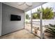 Screened in back patio with a view of a fenced backyard featuring a graveled area and green outdoor furniture at 151 Kirkland St, Goose Creek, SC 29445