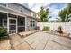 View of the backyard featuring a screened porch, privacy fence, patio and green seating at 151 Kirkland St, Goose Creek, SC 29445