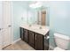 Well-lit bathroom with a double sink vanity, toilet, and tile flooring at 151 Kirkland St, Goose Creek, SC 29445