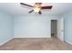 Carpeted bedroom with ceiling fan and a door leading to another room at 151 Kirkland St, Goose Creek, SC 29445