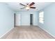 Light blue bedroom with plush carpeting and natural light from windows at 151 Kirkland St, Goose Creek, SC 29445