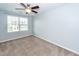 Comfortable bedroom with plush carpet, ceiling fan, and a window at 151 Kirkland St, Goose Creek, SC 29445