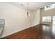 Dining room with high ceilings, hardwood floors, and a modern light fixture at 151 Kirkland St, Goose Creek, SC 29445
