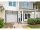 Charming townhome featuring a well-manicured front yard and attached garage at 151 Kirkland St, Goose Creek, SC 29445