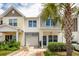 Charming townhome featuring a well-maintained front yard and a lovely palm tree at 151 Kirkland St, Goose Creek, SC 29445