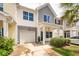 Townhome featuring attached garage, covered entrance, and well-manicured landscaping at 151 Kirkland St, Goose Creek, SC 29445