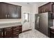 Kitchen featuring stainless steel appliances, granite countertops, dark cabinets, with a back door at 151 Kirkland St, Goose Creek, SC 29445