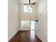 Open living room with hardwood floors, staircase, and blue front door at 151 Kirkland St, Goose Creek, SC 29445