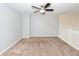 Loft area with neutral carpet, a ceiling fan, and white railings at 151 Kirkland St, Goose Creek, SC 29445