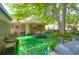 Outdoor dining set on a green lawn under a shady tree in the backyard at 1575 Langston Dr, Johns Island, SC 29455