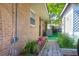 Brick home exterior featuring a landscaped walkway and AC unit at 1575 Langston Dr, Johns Island, SC 29455