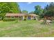 Attractive single-story home with a well-kept lawn and vibrant landscaping at 1575 Langston Dr, Johns Island, SC 29455