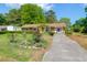 Well-maintained single-story home featuring a charming front yard garden at 1575 Langston Dr, Johns Island, SC 29455
