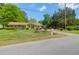 Single-story home with charming curb appeal, landscaped yard, and inviting entrance at 1575 Langston Dr, Johns Island, SC 29455