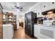 Functional kitchen featuring white appliances, abundant cabinet space, and convenient access to the living area at 1575 Langston Dr, Johns Island, SC 29455