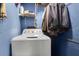 Small laundry room with a white washing machine and blue walls at 1575 Langston Dr, Johns Island, SC 29455