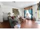 Living room with decorative lamps, area rug and lots of natural light at 1575 Langston Dr, Johns Island, SC 29455