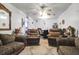 Living room with cozy furnishings, a ceiling fan, and access to the dining area at 1575 Langston Dr, Johns Island, SC 29455