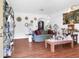 Bright living room with hardwood floors, decorated with vintage furnishings and unique decor at 1575 Langston Dr, Johns Island, SC 29455