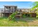Expansive backyard with a deck and screened in porch, perfect for outdoor living and entertaining at 1616 Refuge Run, Charleston, SC 29412