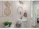 Half bathroom features a stylish vanity and decorative mirror at 1616 Refuge Run, Charleston, SC 29412