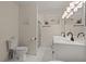 Bright bathroom features a double sink vanity and shower at 1616 Refuge Run, Charleston, SC 29412