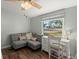 Bright bedroom with hardwood floors and a comfortable seating area at 1616 Refuge Run, Charleston, SC 29412