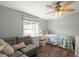 Bright bedroom with hardwood floors and a comfortable seating area at 1616 Refuge Run, Charleston, SC 29412