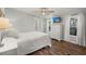 Bright bedroom with large windows, white dresser, and ceiling fan at 1616 Refuge Run, Charleston, SC 29412