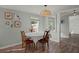 Charming dining area featuring wood floors, natural light and stylish decor at 1616 Refuge Run, Charleston, SC 29412