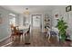 Bright dining area with hardwood floors, transitional décor, and ample natural light, perfect for Gathering gatherings at 1616 Refuge Run, Charleston, SC 29412