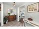 Elegant entryway featuring stylish furnishings, a decorative mirror, and hardwood floors for a welcoming atmosphere at 1616 Refuge Run, Charleston, SC 29412