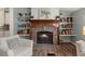 Inviting fireplace with stone surround and built-in shelving for books and décor, a cozy focal point at 1616 Refuge Run, Charleston, SC 29412