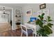 Bright office space with desk, shelving and a large indoor plant at 1616 Refuge Run, Charleston, SC 29412