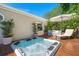 Soothing hot tub with an umbrella and lounge chair on a wooden deck, offering a private retreat at 1616 Refuge Run, Charleston, SC 29412