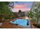 Relaxing hot tub on wooden deck with a vibrant sunset, perfect for outdoor leisure and entertaining guests at 1616 Refuge Run, Charleston, SC 29412