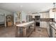 Spacious kitchen area with stainless steel appliances, a central island, and modern finishes at 1616 Refuge Run, Charleston, SC 29412