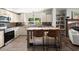 Bright kitchen with stainless steel appliances, white cabinets, and central island at 1616 Refuge Run, Charleston, SC 29412